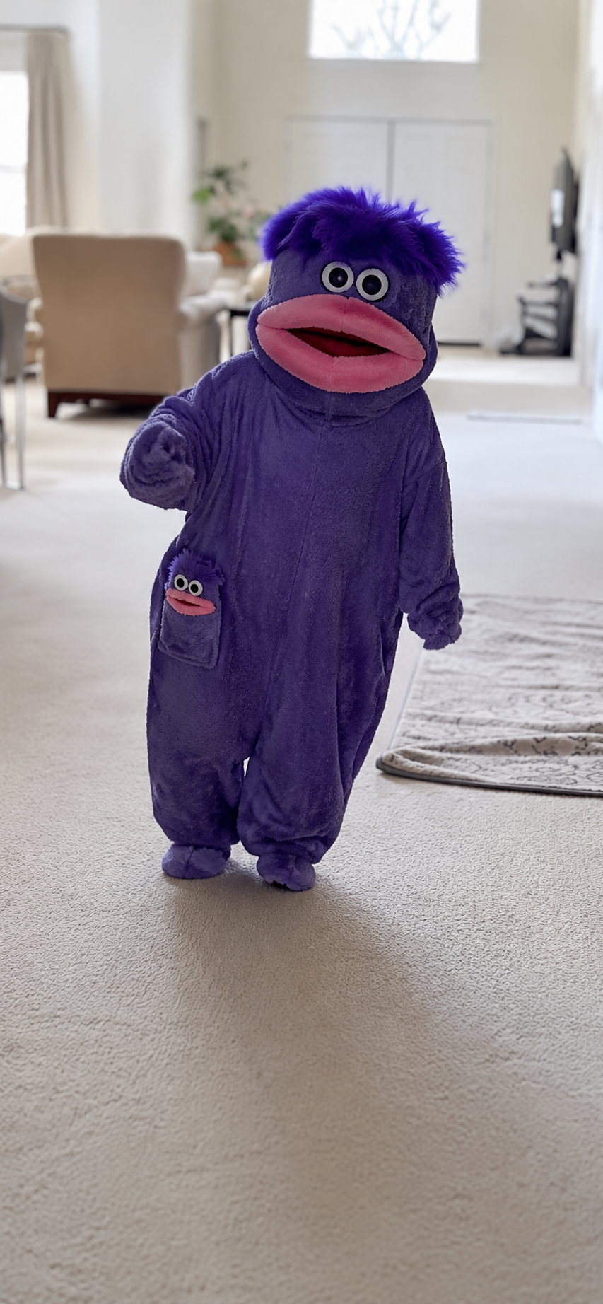Customer wearing purple Snuggle onesie